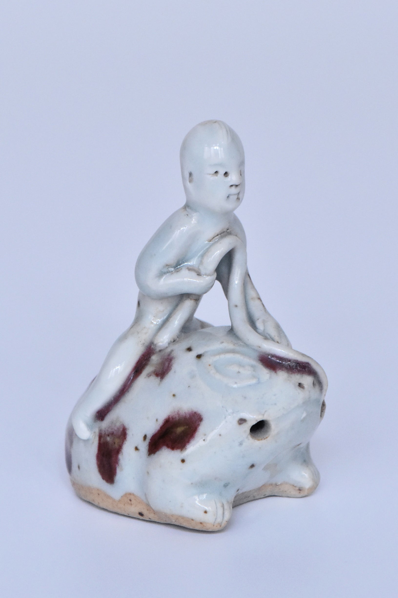R346: Chinese Copper Red Decorated Figure of a Boy on a Frog Yuan Dynasty Style