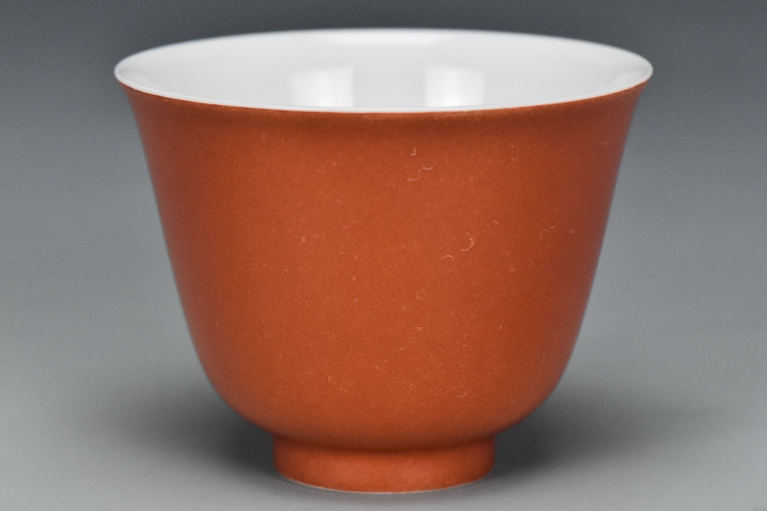 P240: A CHINESE QING DYNASTY STYLE CORAL RED GLAZED CUP KANGXI MARK