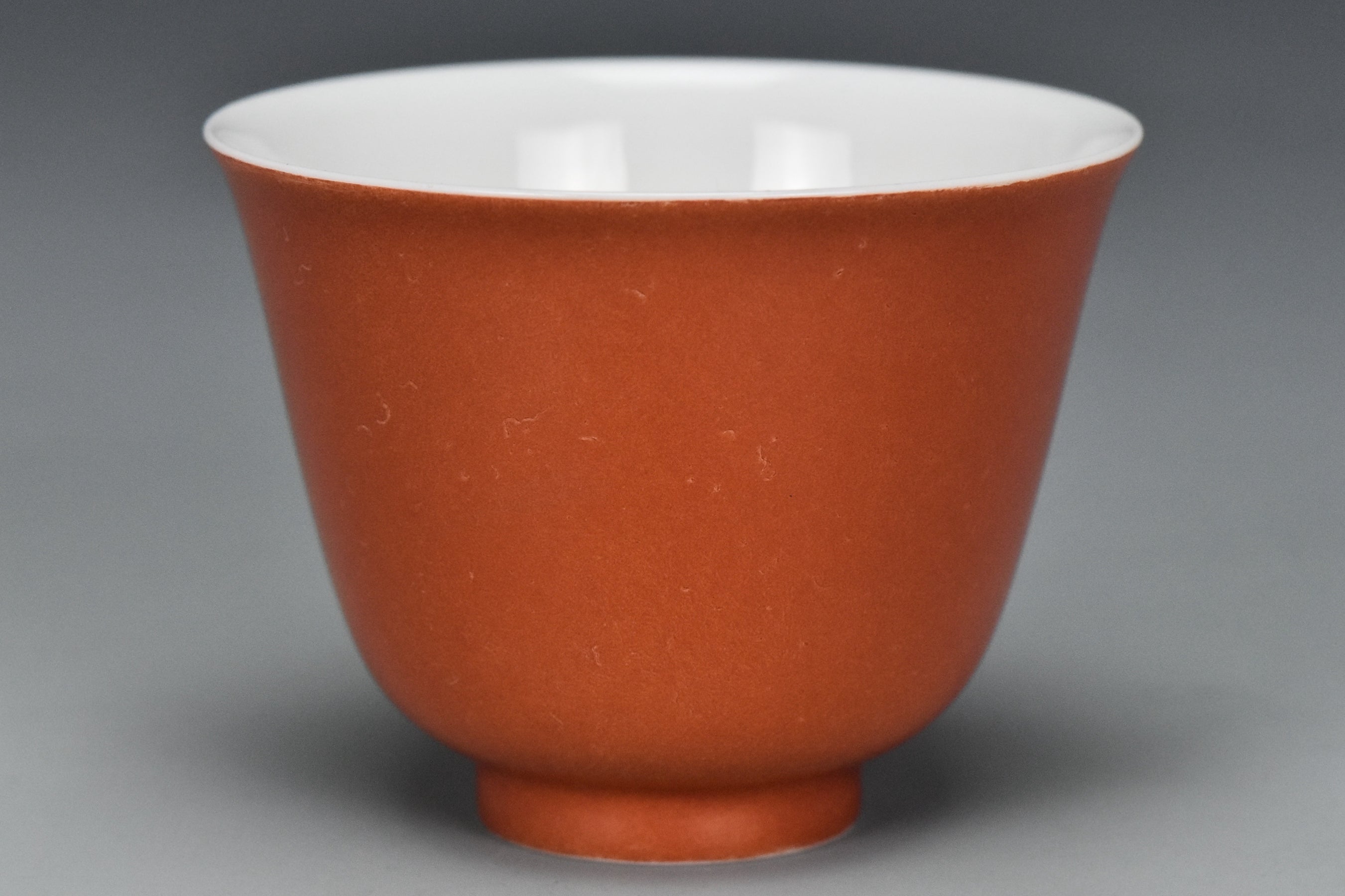 P240: A CHINESE QING DYNASTY STYLE CORAL RED GLAZED CUP KANGXI MARK