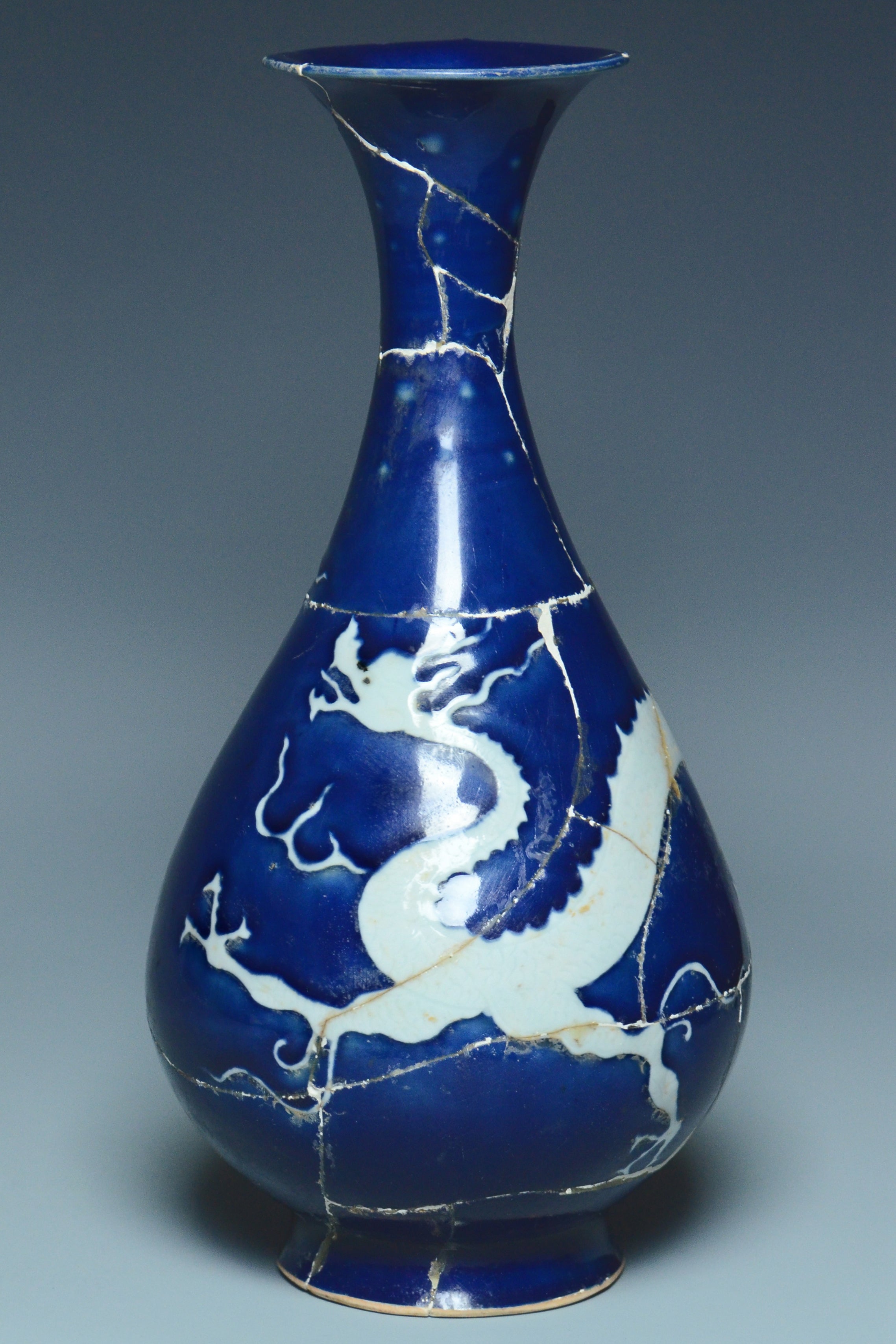 P279: A CHINESE YUAN DYNASTY STYLE BLUE GROUND DRAGON VASE