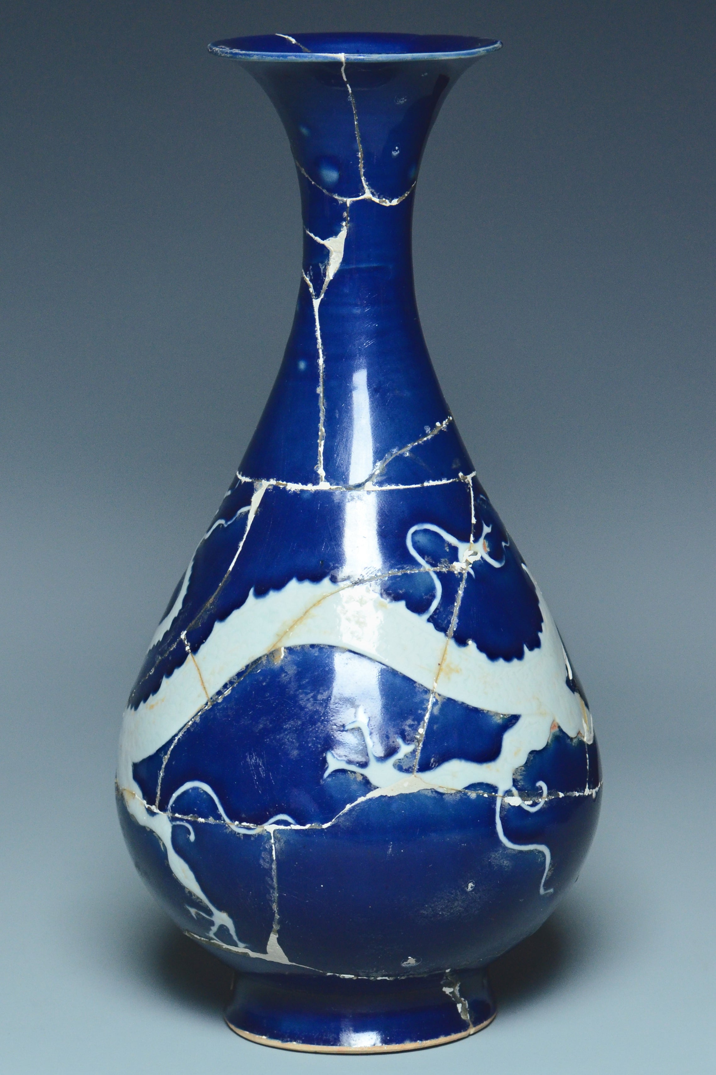 P279: A CHINESE YUAN DYNASTY STYLE BLUE GROUND DRAGON VASE