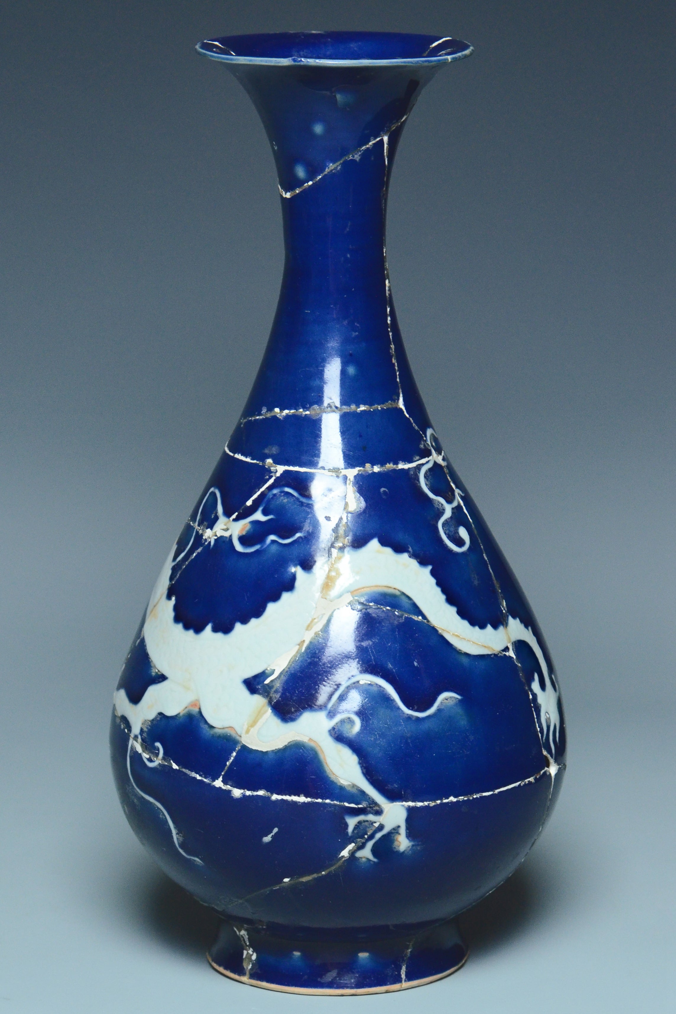 P279: A CHINESE YUAN DYNASTY STYLE BLUE GROUND DRAGON VASE