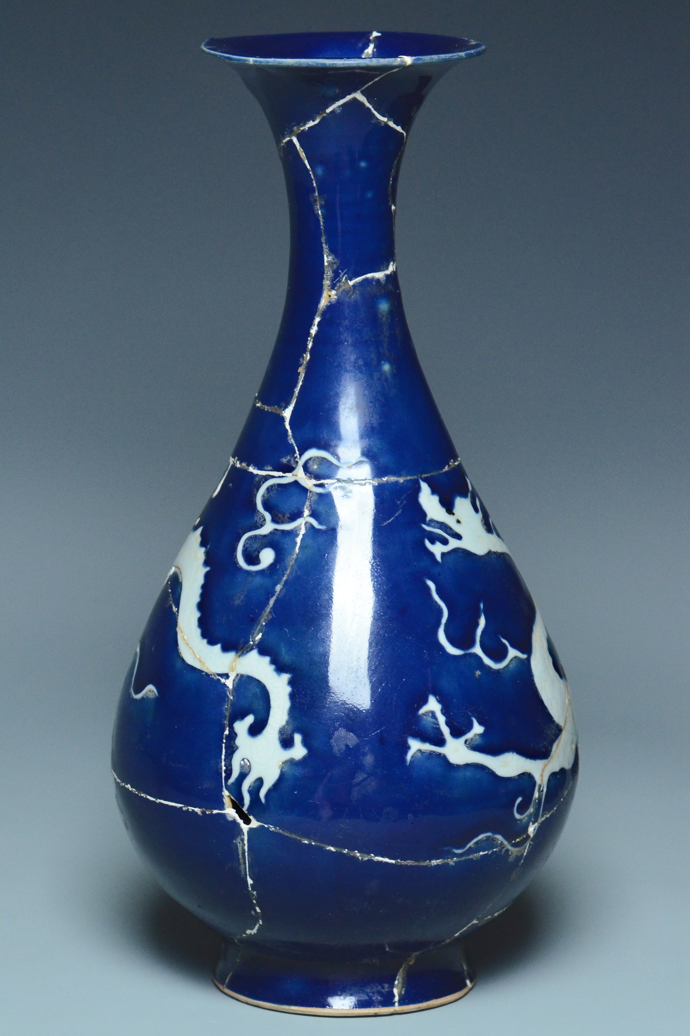 P279: A CHINESE YUAN DYNASTY STYLE BLUE GROUND DRAGON VASE