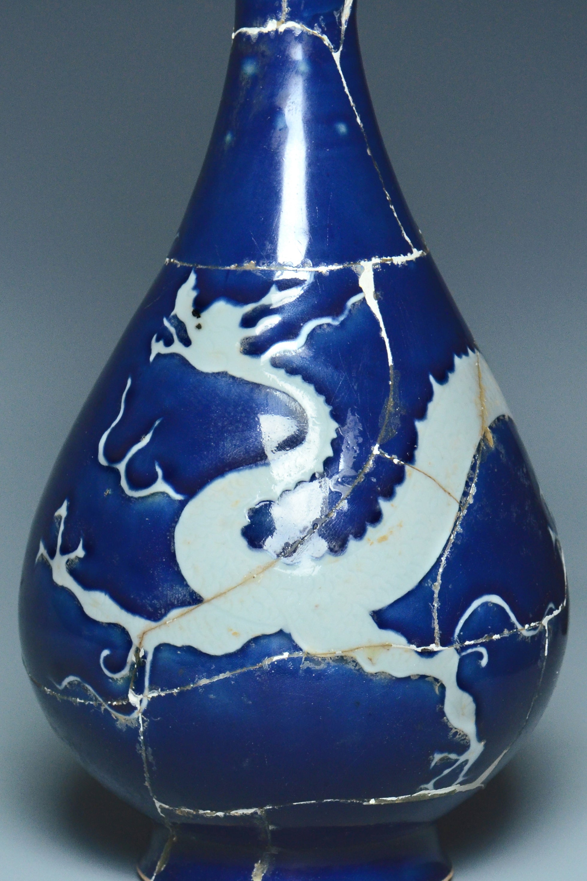 P279: A CHINESE YUAN DYNASTY STYLE BLUE GROUND DRAGON VASE