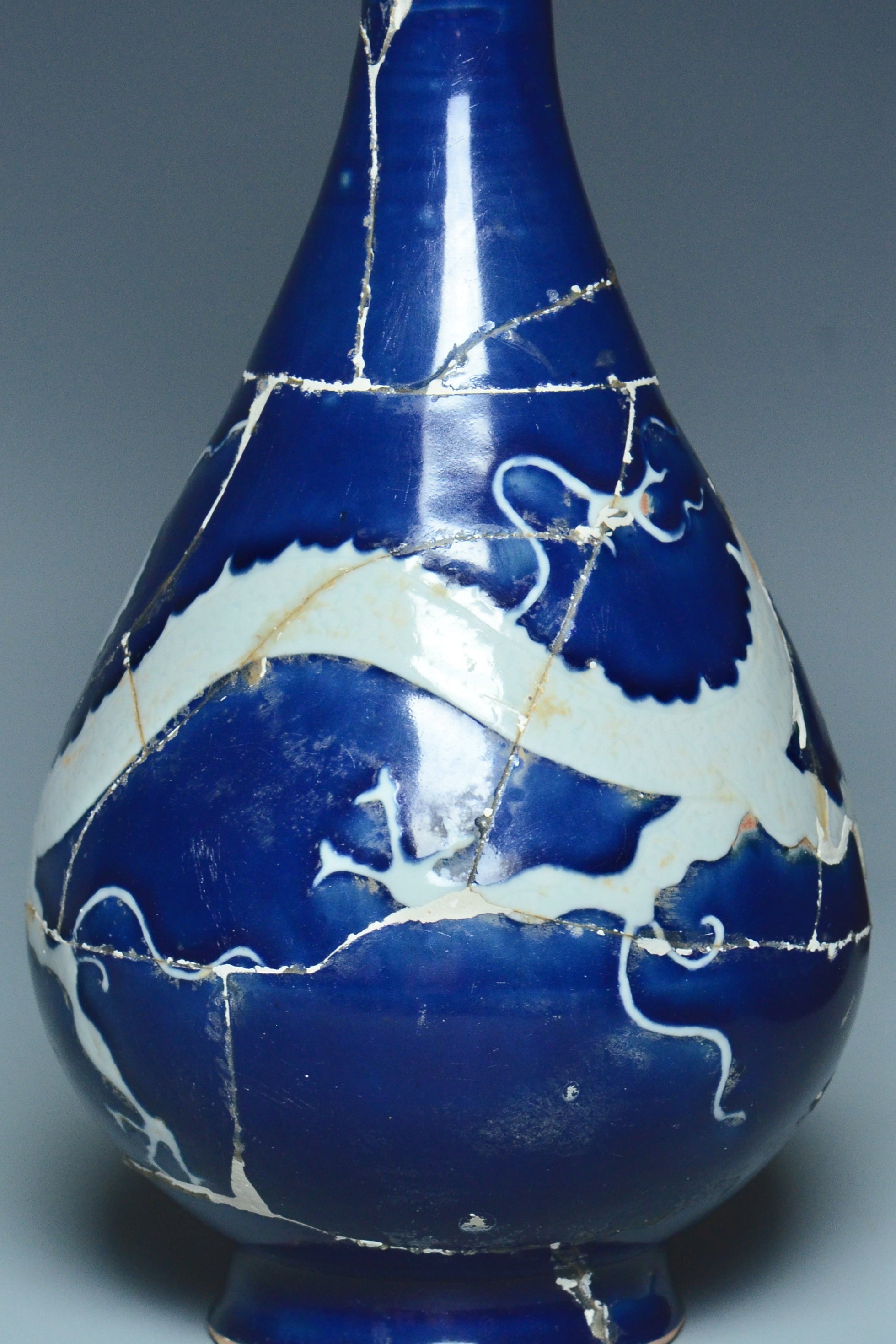 P279: A CHINESE YUAN DYNASTY STYLE BLUE GROUND DRAGON VASE