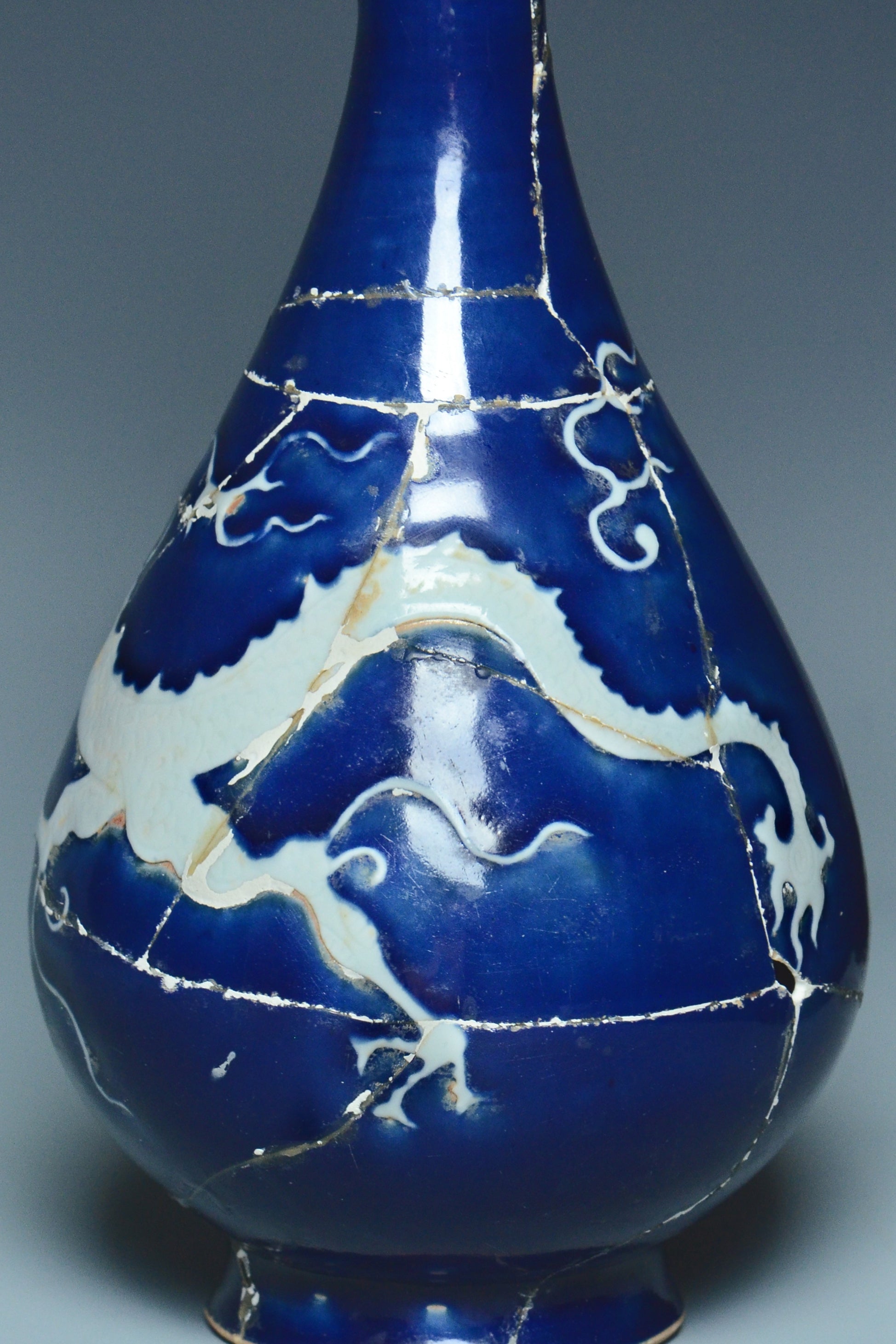 P279: A CHINESE YUAN DYNASTY STYLE BLUE GROUND DRAGON VASE