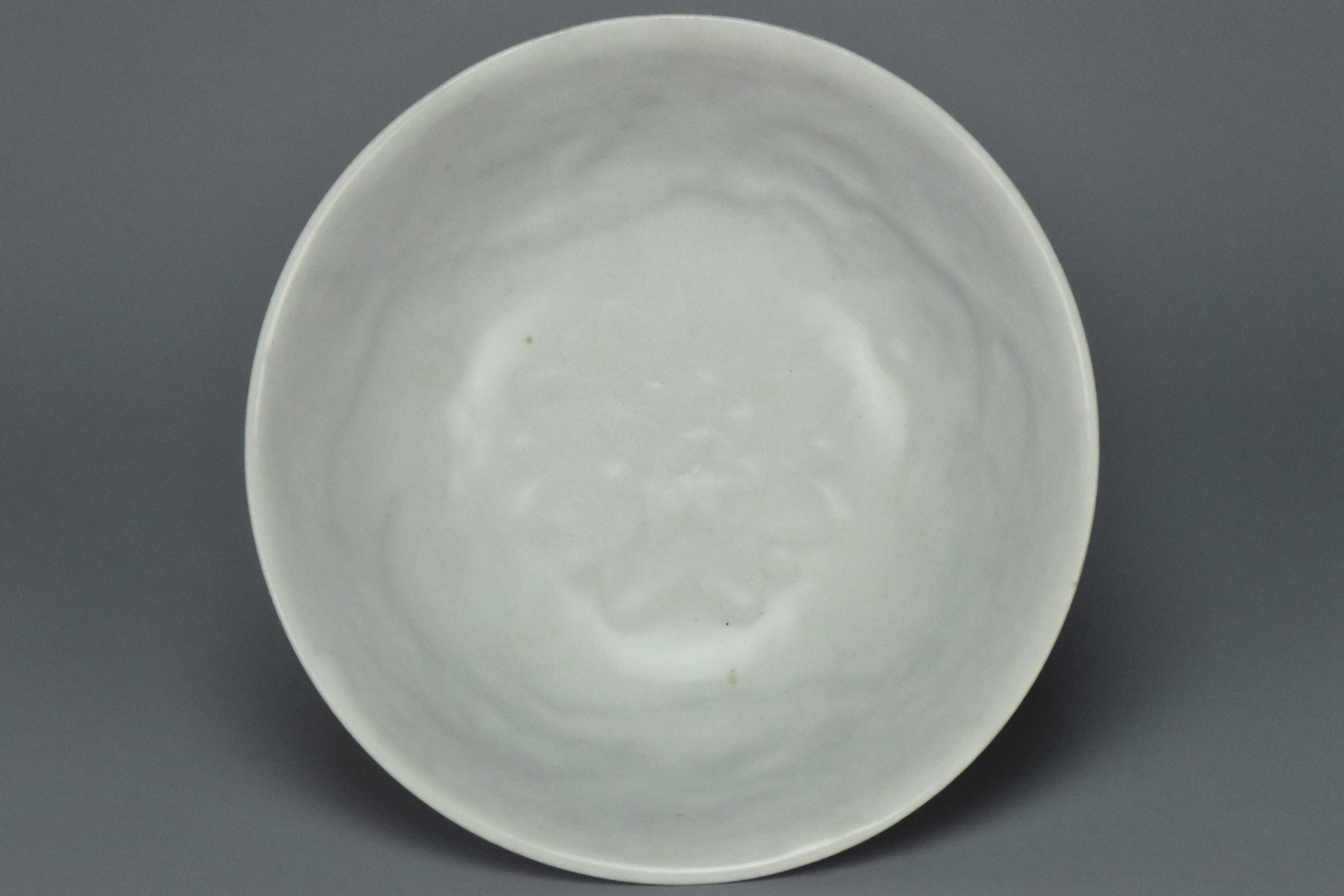 P902: A CHINESE YUAN DYNASTY SHUFU WHITE GLAZED DRAGON BOWL